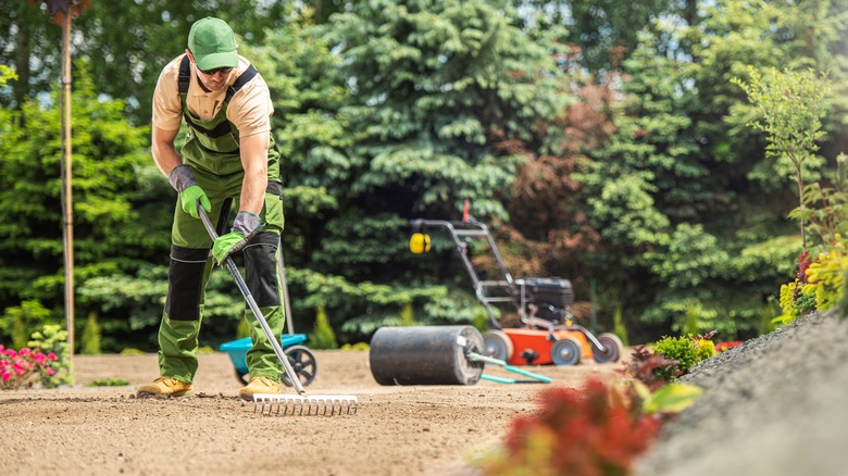 man tilling a garden