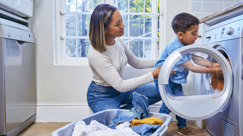 Woman and child doing laundry