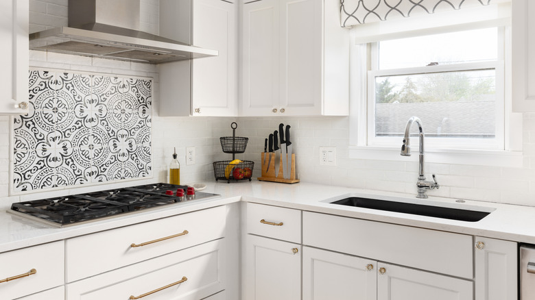 white kitchen with gold drawer pulls