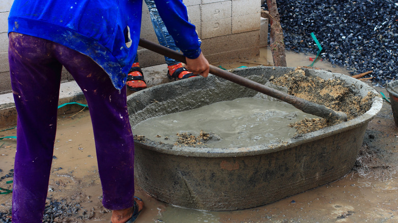mixing a batch of concrete in the backyard