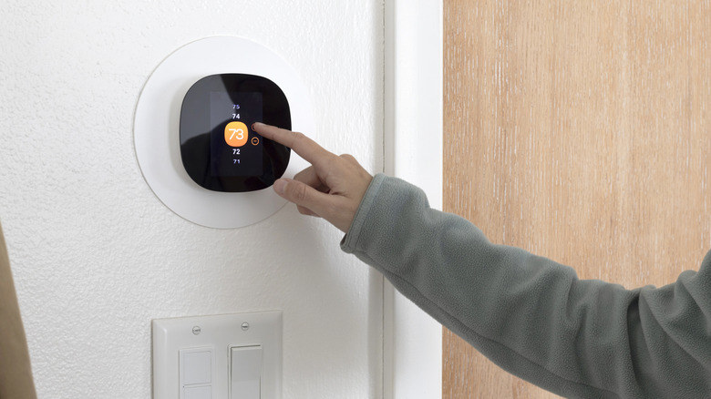 Person raises the temperature on the thermostat, even though their 80% AFUE furnace may cost them more money.