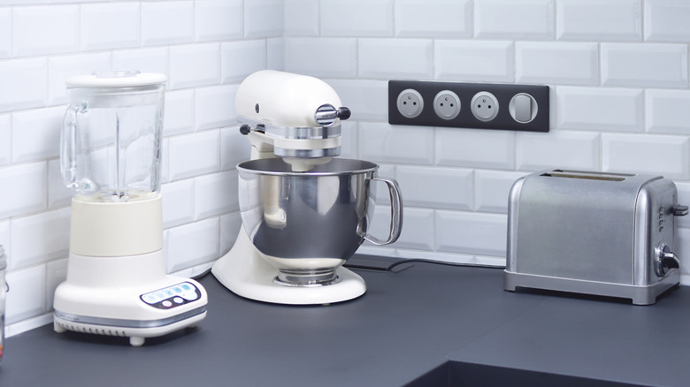 KitchenAid stand mixers in counter on top of kitchen counter