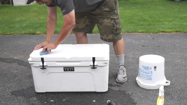 Gray Yeti cooler outside of a garage