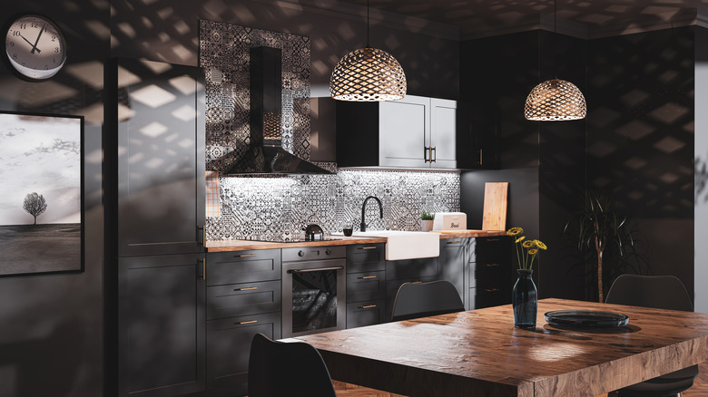 Dark kitchen with wood table