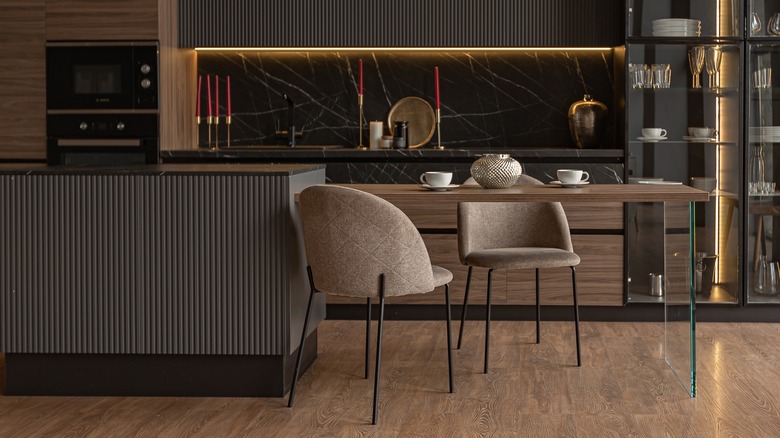 Two chairs in brown kitchen