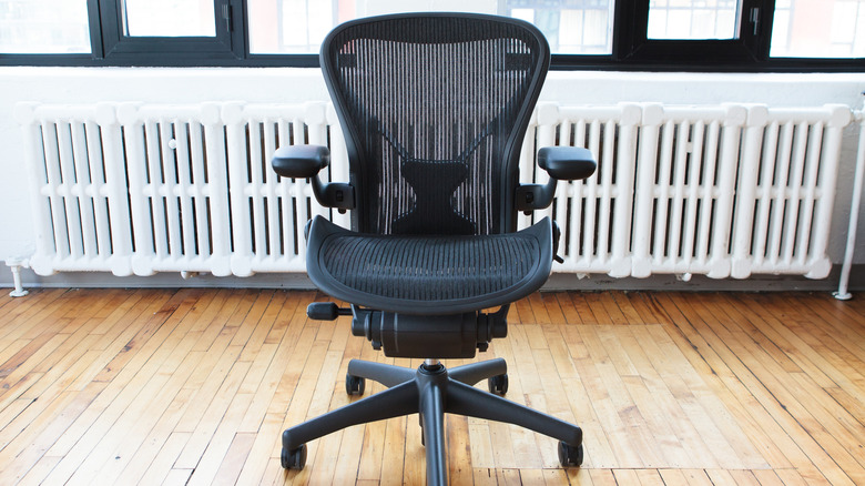 An office chair with multiple adjustable features on a hardwood floor