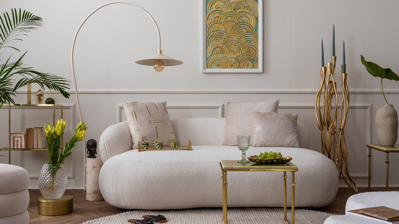living room with round sofa and decor