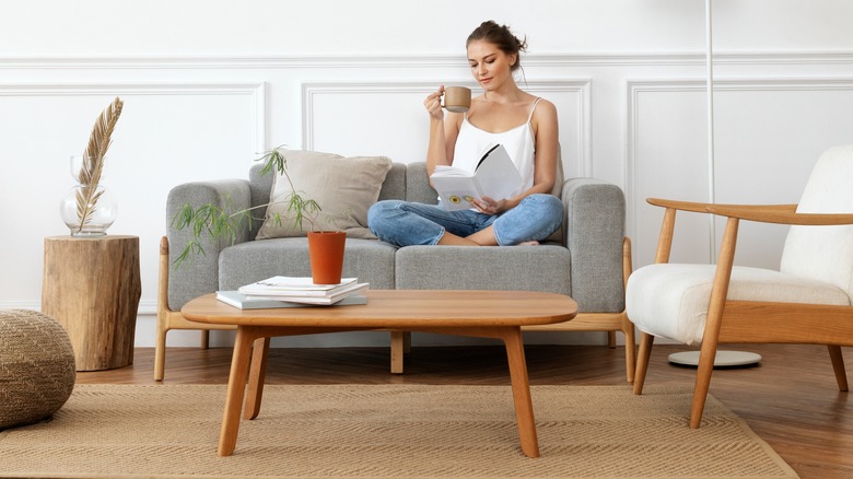 Woman sitting on sofa