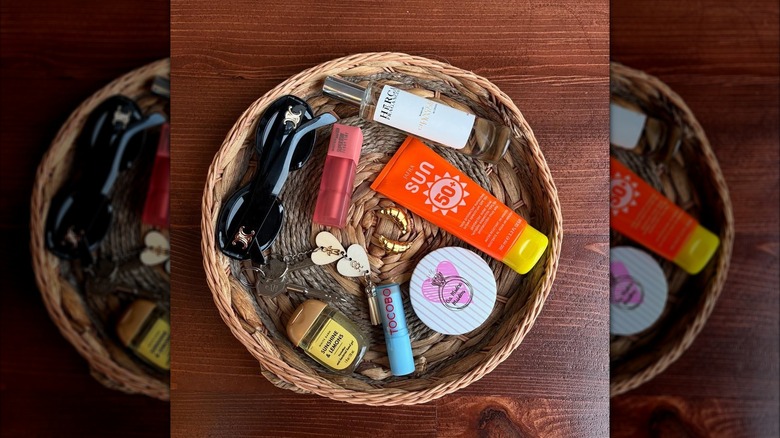 Purse bowl basket with sunglasses, makeup, sunscreen, and keys