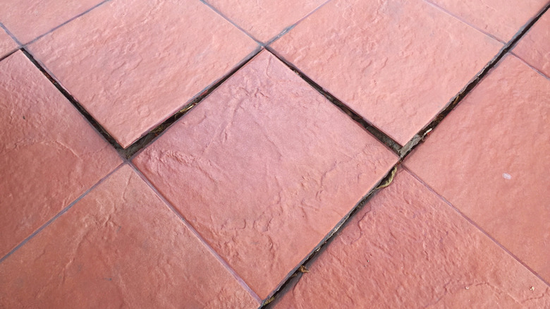 buckled floor tiles