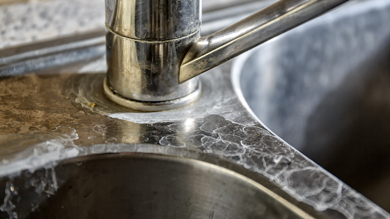 Stainless steel sink stained with limescale