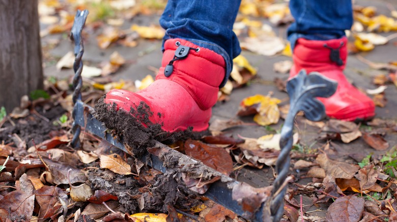 person using a boot scraper
