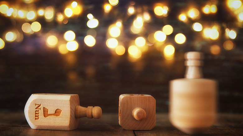 Wooden dreidels gold lights Hanukkah