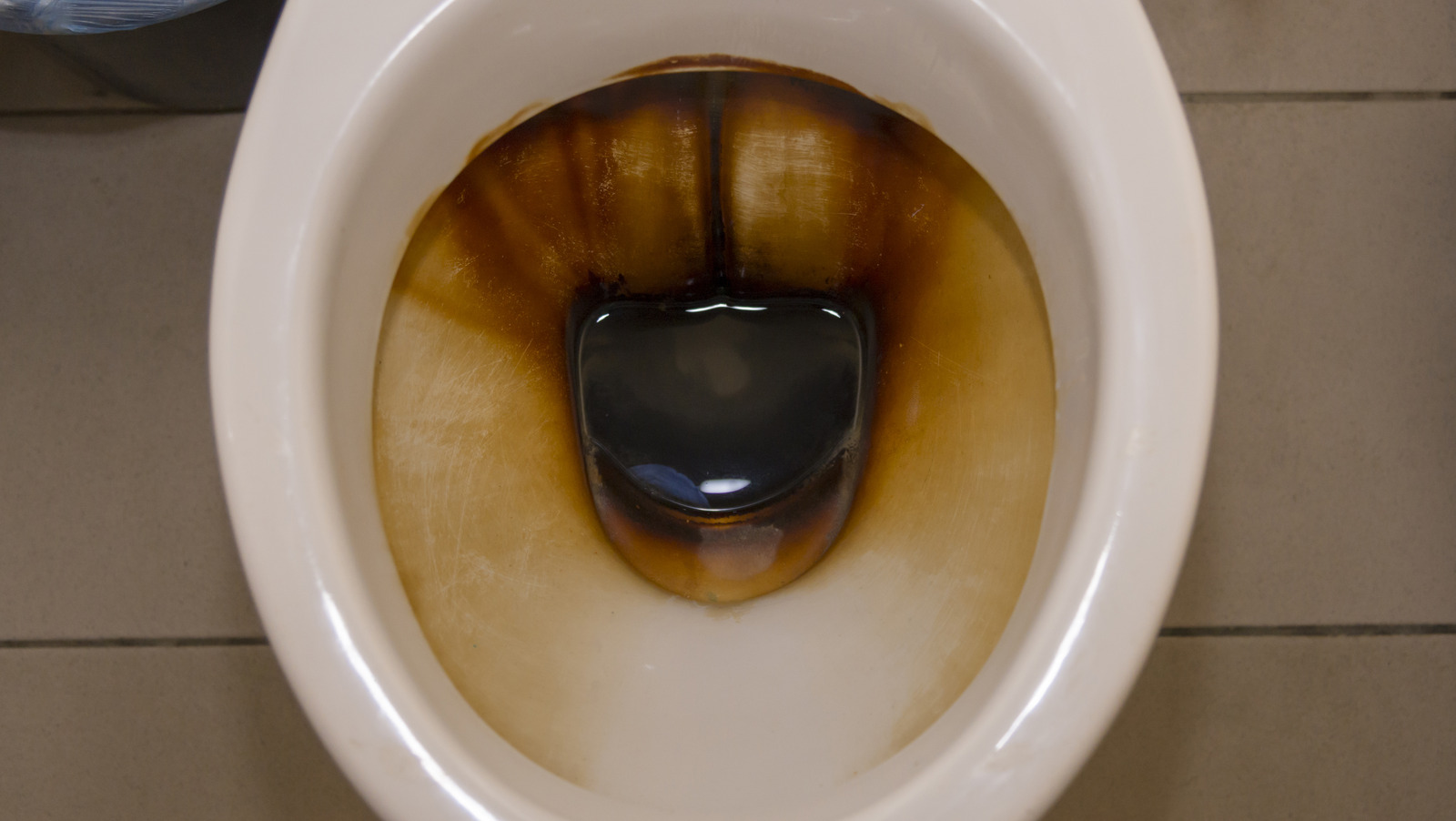 What does it mean if your toilet water is black, and how can you act on it?