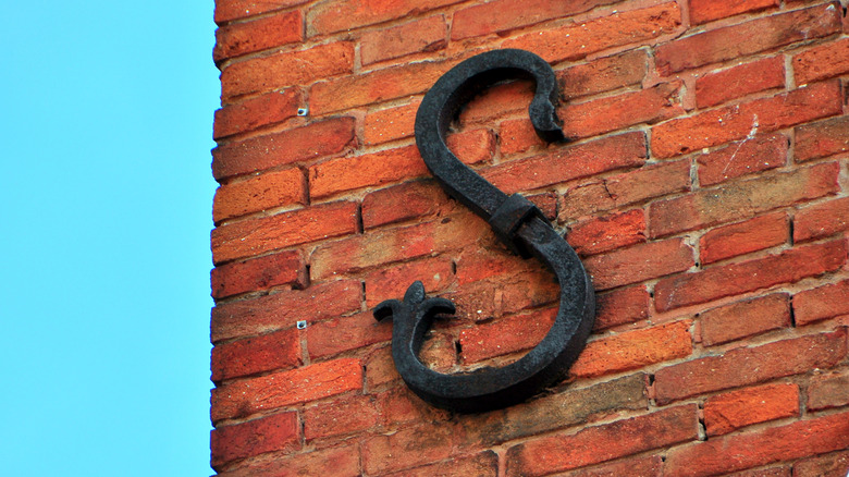 Brick wall with S-shaped metal