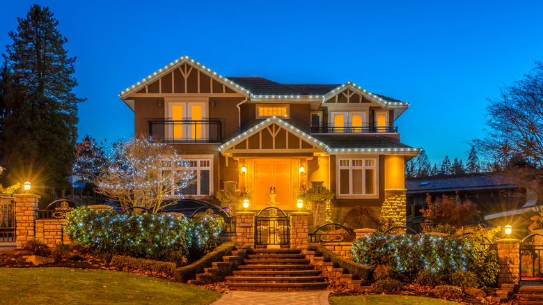 House with yellow porch lights