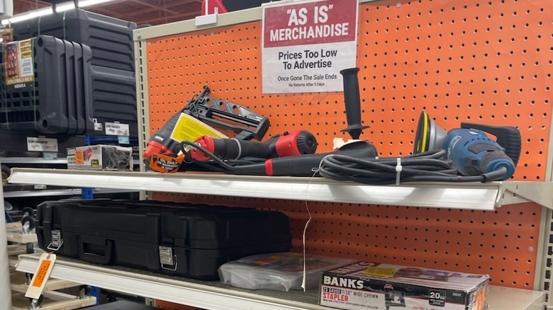 As-is orange tag items on a store shelf at Harbor Freight