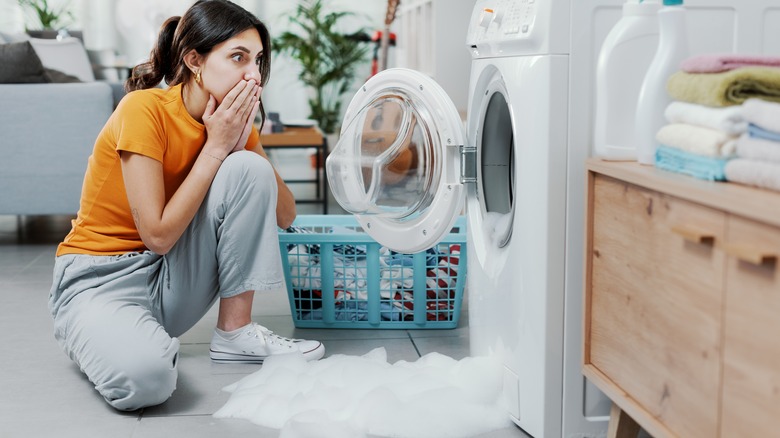 Washer overflowing with suds