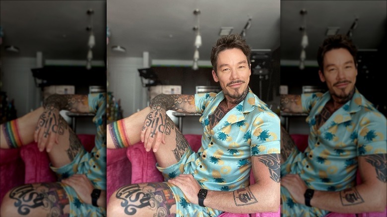 David Bromstad sitting in his house