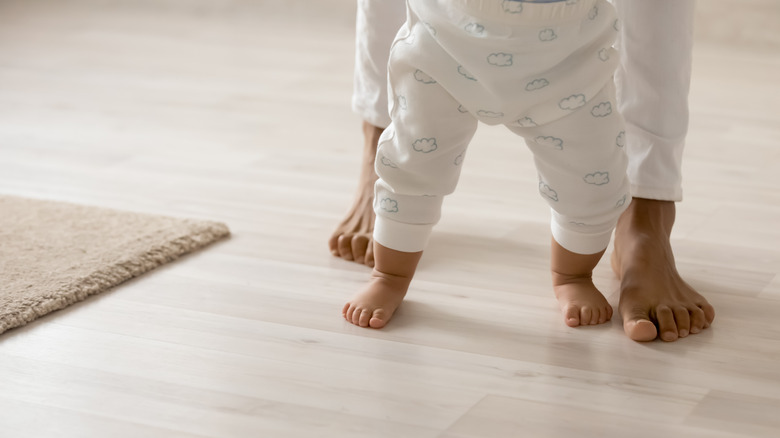 people walking on wood floor