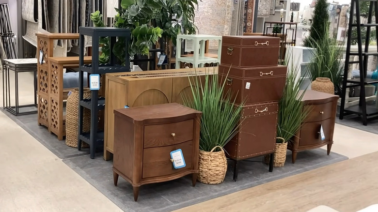 A display of nightstands and shelves at HomeGoods