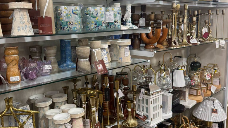 An aisle of candlesticks and candle holders at HomeGoods