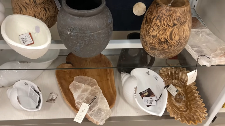 Shelves of decorative trays at a HomeGoods store