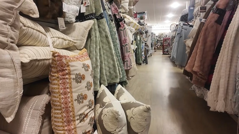 An aisle of throws at HomeGoods