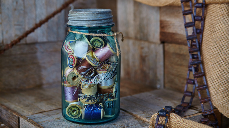 Mason jar filled with thread