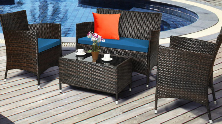 A Costway four piece patio set with peacock blue cushions