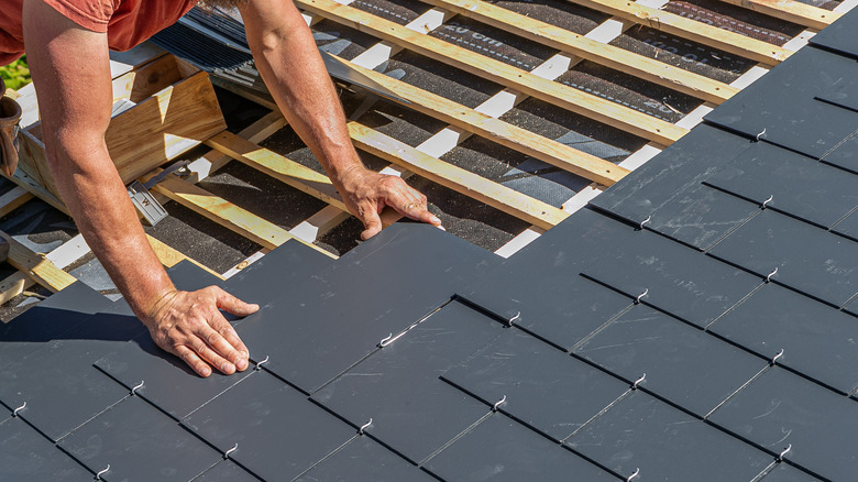 roofer installing slate roof