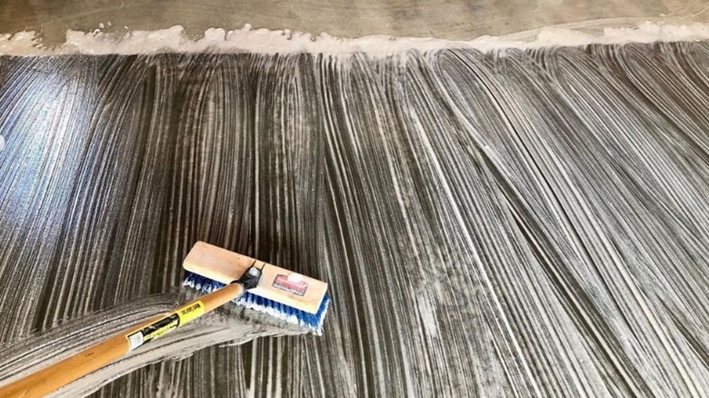 Using broom and soap on efflorescence