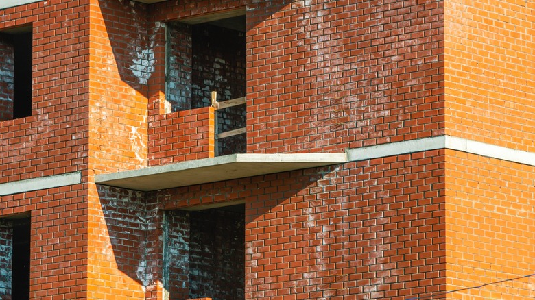 Orange building with white marks