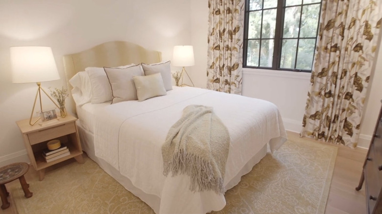A small bedroom with beige decor.