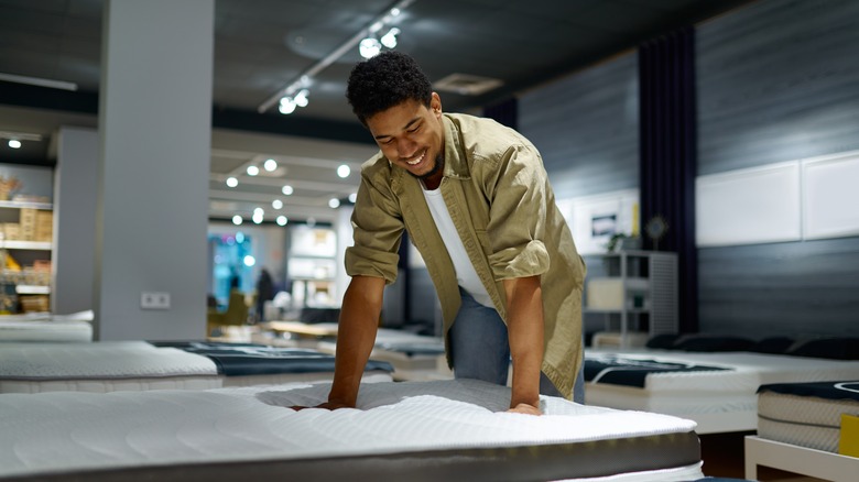 man at mattress store