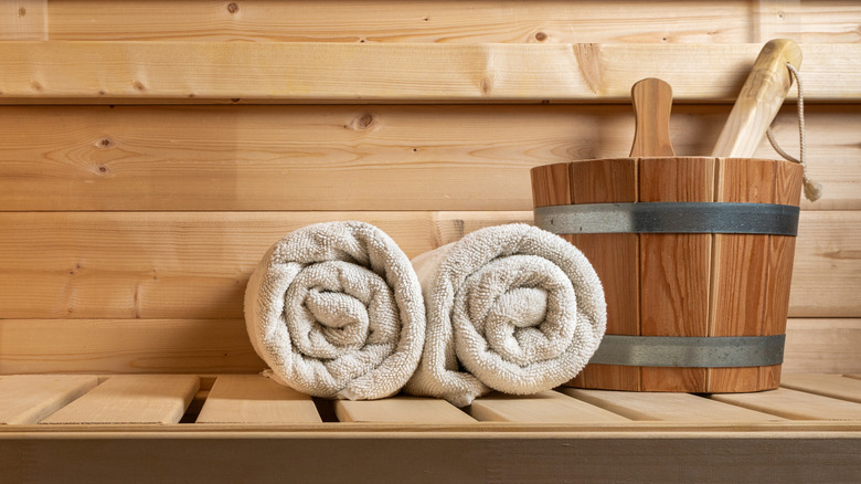 towels and wooden bucket