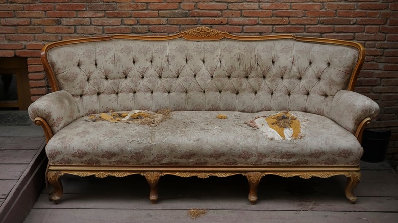 Damaged vintage sofa