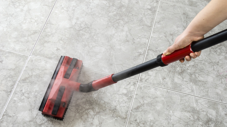Steam mopping tile floor