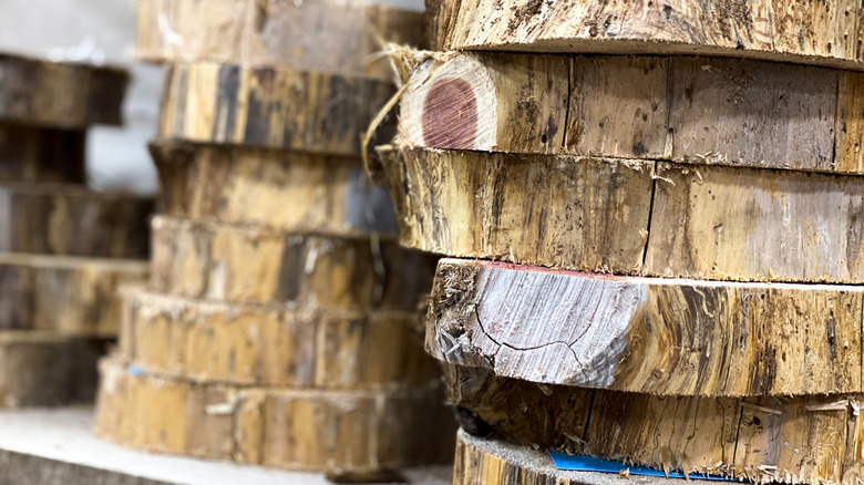 Salvaged wood rounds in two stacks