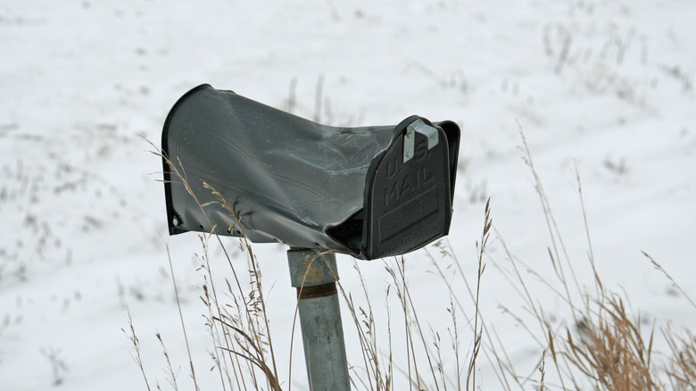 Damaged mailbox after a snowfall