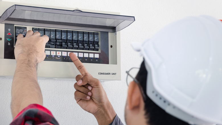 professional tech working at electrical panel
