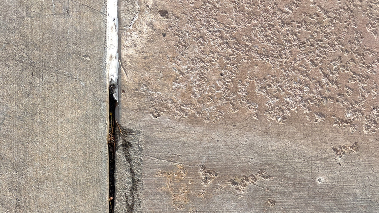 Partially caulked cement pavement crack