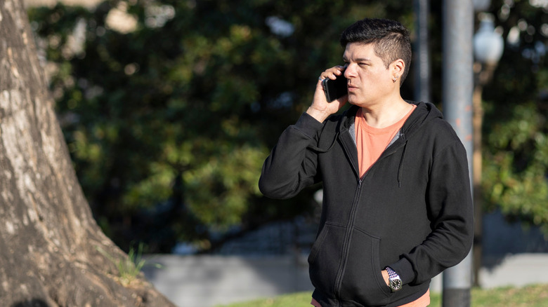 man outdoors on phone