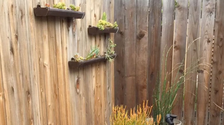 repurposed gutter system parts as planters