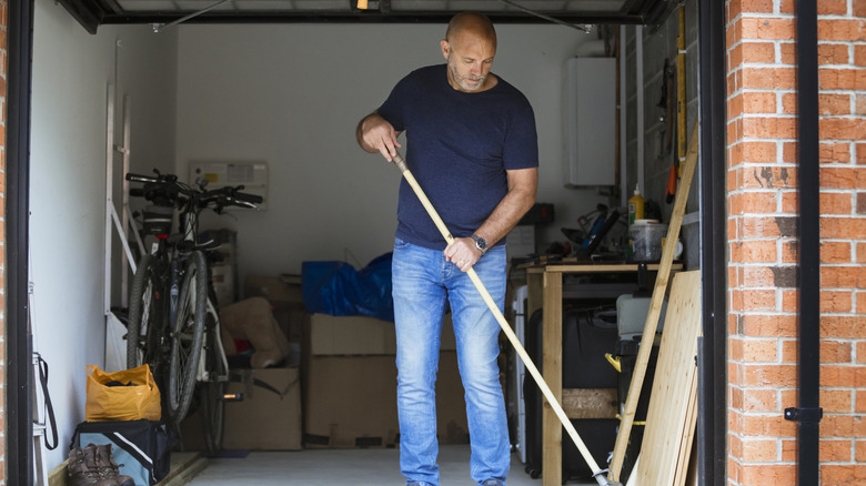 A man cleaning out his garage