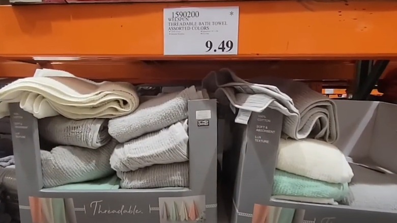 Towels for sale at Costco with an asterisk on the price tag