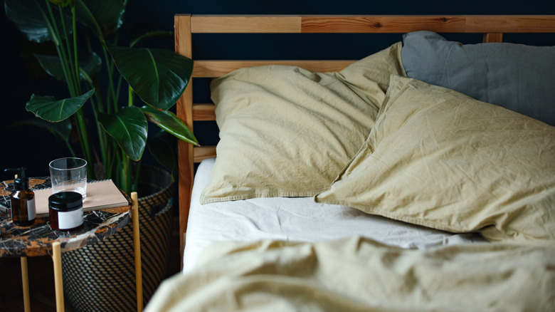 High angle view of an unmade bed in the morning.