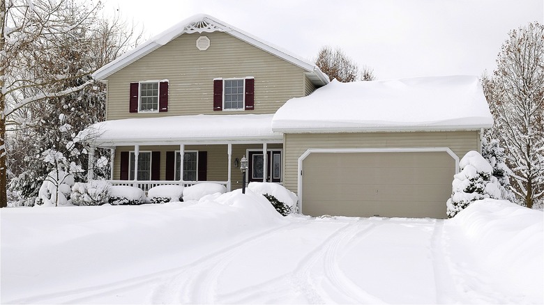 Snow in front of garage