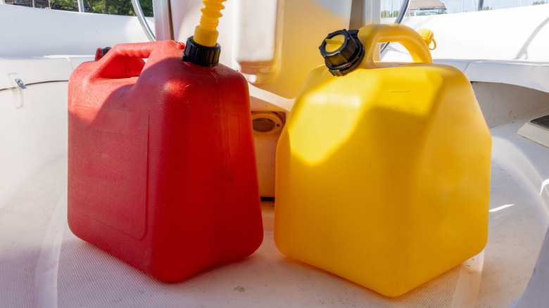 Red and yellow gas cans holding different fuels