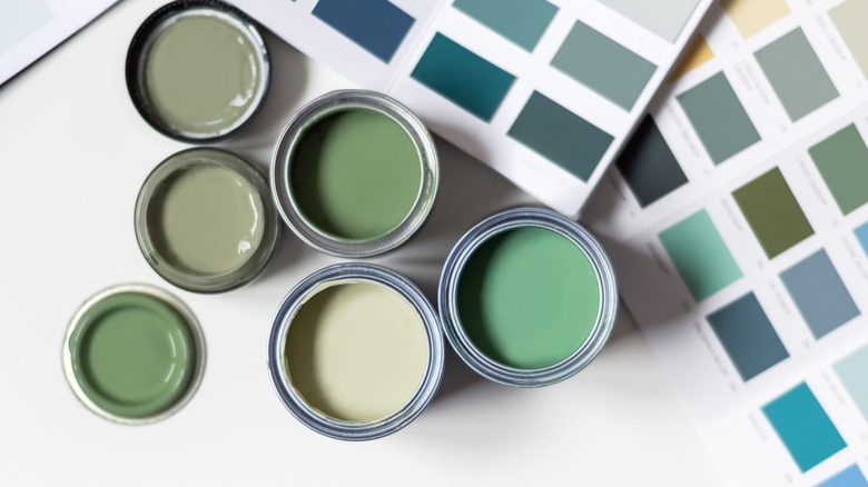 Pale green paints in cans